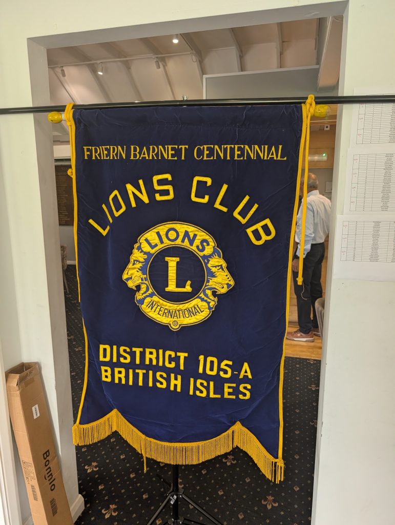 Friern Barnet Centennial Lions Club banner displayed at the charity golf challenge in support of Lifelites.